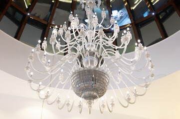big chandelier and white lighting on the wall