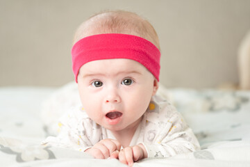 Portrait of a beautiful baby on bright background. New born concept