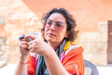 portrait of middle-aged woman having a cup of coffee