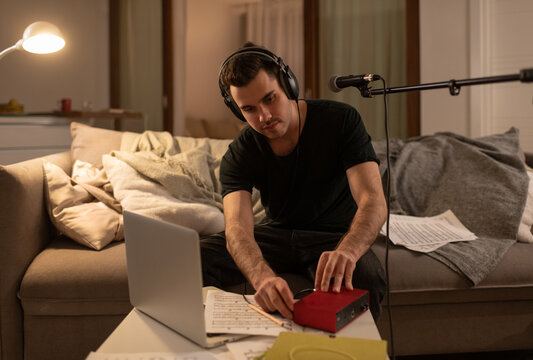 Male musician preparing for online lesson at home