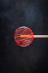 lollipop transparent sweet caramel sugar on stick dessert handmade fresh portion ready to eat meal snack on the table copy space food background rustic top view