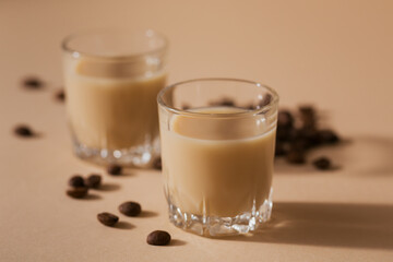 Short glasses of Irish cream Liquor or Coffee Liqueur with coffee beans. Winter holiday decorations