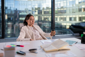 Asian businesswoman resting in office