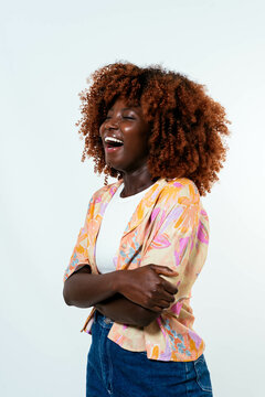 Happy afro woman posing over white background