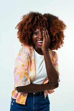 Happy afro woman posing over white background