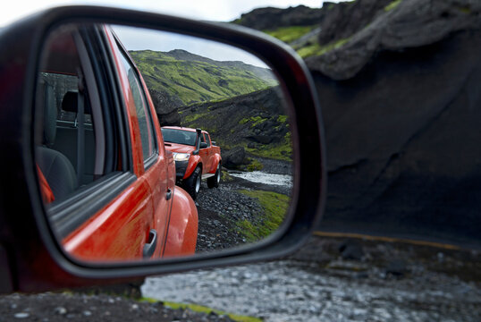 Looking At Modified Pick Up Truck Through Rear View Mirror