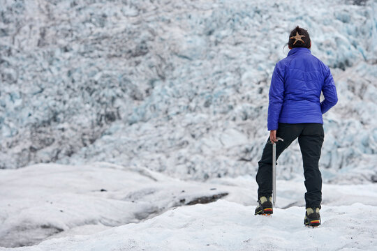 Woman exploring the glacier Fjallsj&ouml;kull in the south of Iceland