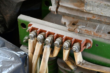 Terminals with cables of an old high voltage transformer.