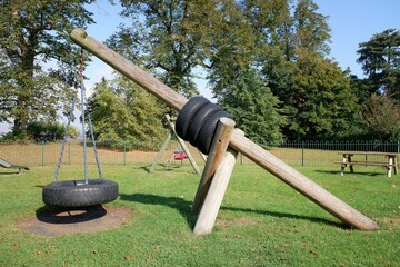 Cantilever basket swing in a children's play area