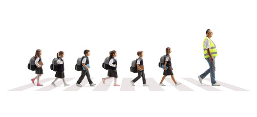 Man wearing a safety vest and leading schoolchildren across a street on a crosswalk