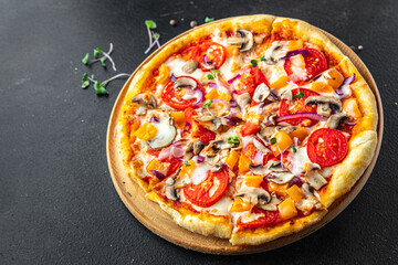 vegetarian pizza vegetable tomato, pepper, onion, mushroom, corn fresh portion ready to eat meal snack on the table copy space food background rustic 