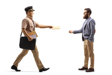 Full length profile shot of a postman delivering letter to a bearded man