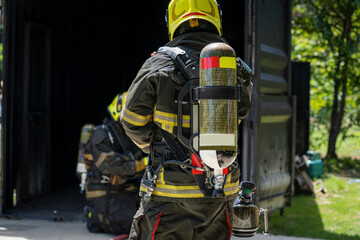 Firefighter portrait on duty,Firefighters in fire fighting operation.