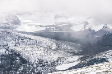 Fototapeta na wymiar Mountain top hiking nature winter snow cold sky horizon