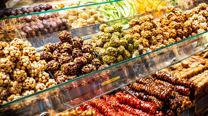 Assorted Turkish delights with different flavors and nuts in different colors, sweets cut into slices