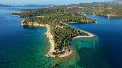 Aerial drone photo of organised with sunbeds and umbrelas paradise beach of Fanari with crystal clear turquoise sea, Meganisi island, Ionian, Greece