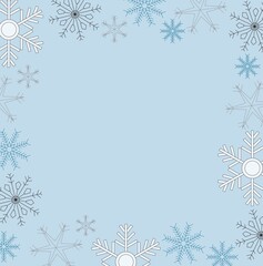 Black, blue, white and grey snowflakes forming frame around edge of illustration with copy space in center on pale blue background. Winter, seasonal, holidays.