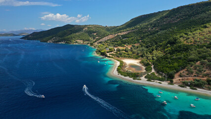 Aerial drone photo of paradise exotic azure beach of Agios Ioannis a famous yacht and sail boat...