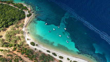 Aerial drone photo of paradise exotic azure beach of Agios Ioannis a famous yacht and sail boat visit in Ionian island of Meganisi, Greece