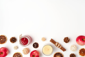 Autumn flat lay composition of apples, fall foods and decor on white background. Ingredients for jam or mulled wine. Autumn or winter holiday food concept. Creative trendy flat lay with place for text
