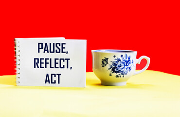pause, meditation, action concept - abstract word on notepad with a cup of coffee