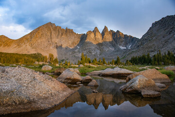 Evening light on the breathtaking Cirque of Towers, seen from Shadow Lake, Wind River Range, Wyoming, USA