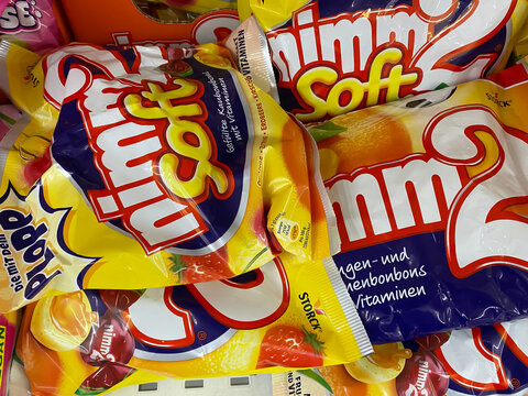 Viersen, Germany - June 9. 2021: Closeup of packs nimm2 sweets in shelf of german supermarket (focus on right central pack)