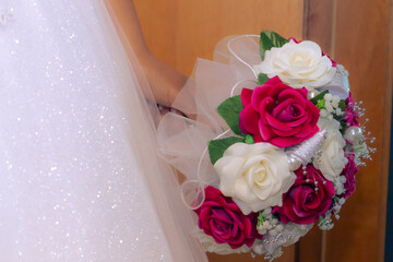 Bride holding bouquet at the wedding ceremony