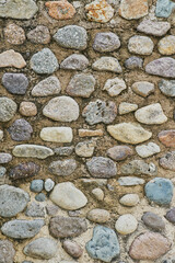 Tidy inlaid stone wall forming a decorative residential pattern