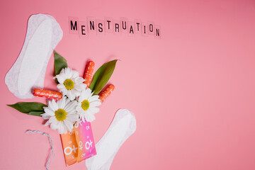 Womans comfort and hygienic protection, menstruation, sanitary pads on pink background. Critical days.