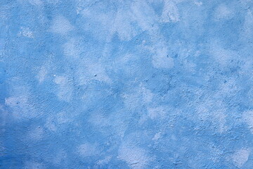 Natural old wall with fresh plaster, painted blue, texture for photo design, for making photo backdrops, banner for advertisement or invitation, place for text,