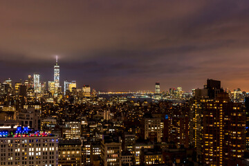 Fototapeta na wymiar Overhead view of various buildings at night in Manhattan.
