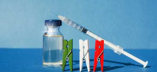 virus body and syringe with vaccine, concept of mass vaccination of the population battle against covid 19 italian flag 	
