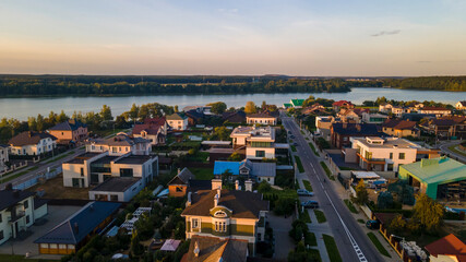 Aerialphoto suburbs of big city. Country houses, forests, lakeshore. Citylife concept.