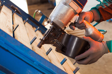 Carpenter man at woodworking factory working place
