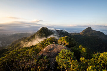 Fototapeta premium Beautiful view to green rainforest mountains and clouds in Tijuca Park
