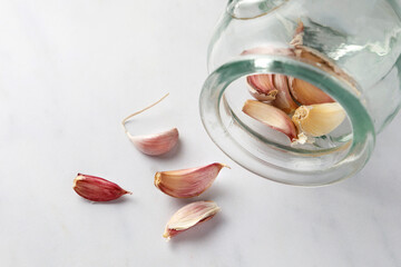 Garlic closeup on white marble table