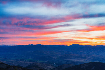 Red and orange clouds during sunrise in Methow valley, Washington