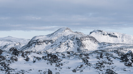 Fototapeta na wymiar Snowy mountains on Hellisheidi, Iceland