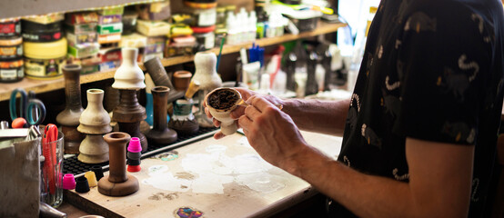 man doing the hookah with a tobacco, traditional eastern aroma smoking