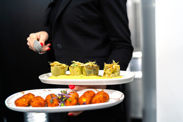 waiter ready to serve the delicious dishes