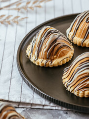 homemade desserts with caramel, nuts on a light background
