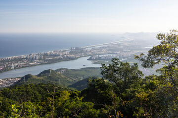 Beautiful view from green rainforest mountain to city and ocean