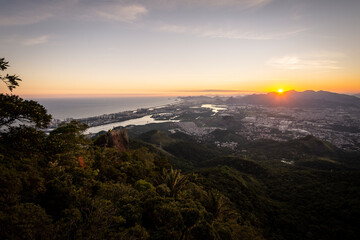 Beautiful view to the sunset and the city from rainforest mountain