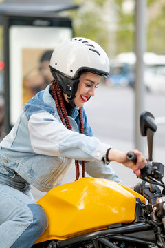 Close-up of a young woman riding a motorcycle