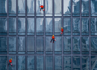 window cleaner's working on facade of high rise building in Bangkok