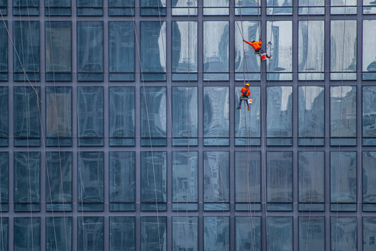 window cleaner's working on facade of high rise building in Bangkok