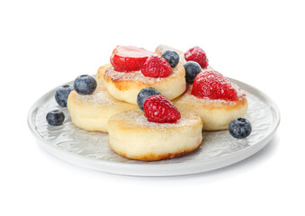 Plate with tasty cottage cheese pancakes and berries on white background