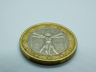 one euro coin with the representation of the Vitruvian man