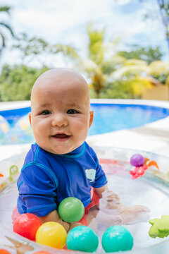 Beautiful Baby Playing In Pool